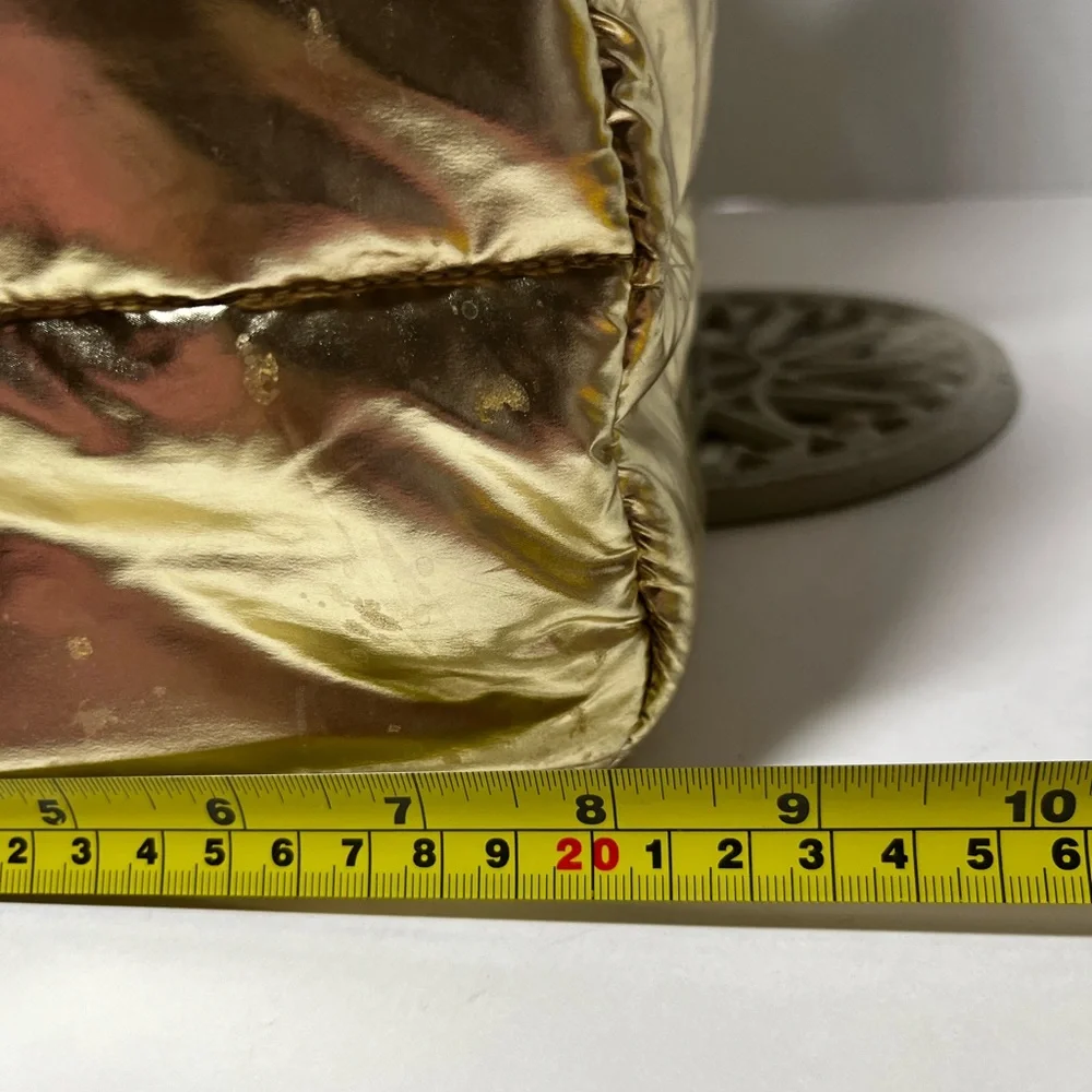 Justice Gold, metallic duffel bag